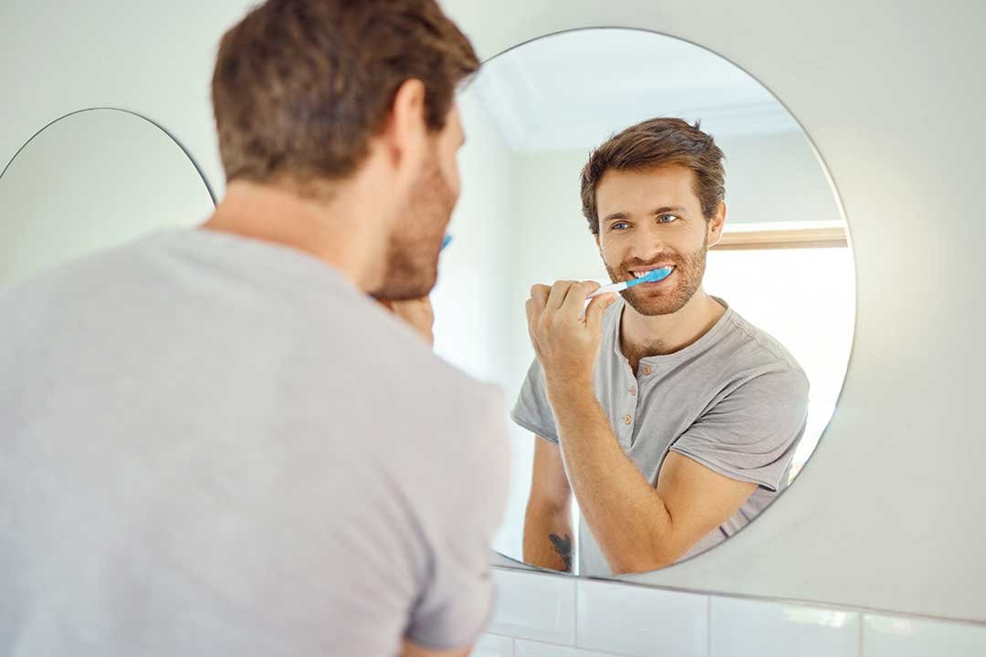 Should I brush my dental implants immediately?
